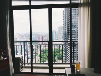 Buildings seen through glass window