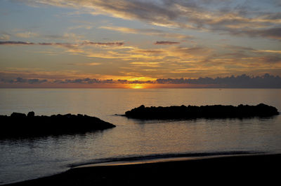 Scenic view of sea against sky during sunset