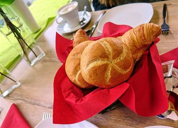 High angle view of breads in container on table