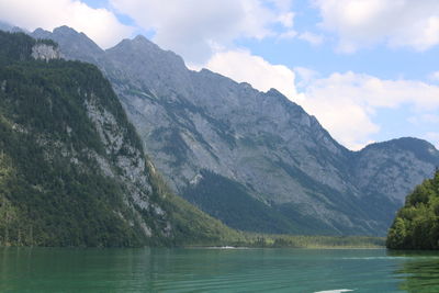 Scenic view of lake and mountains against sky