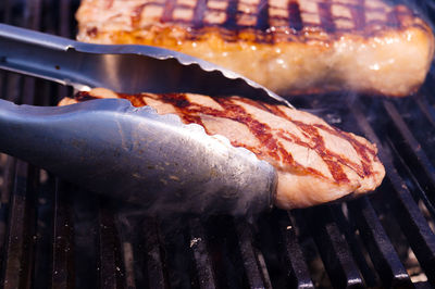 Close-up of meat on barbecue grill