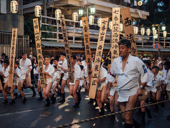 Group of people on street in city