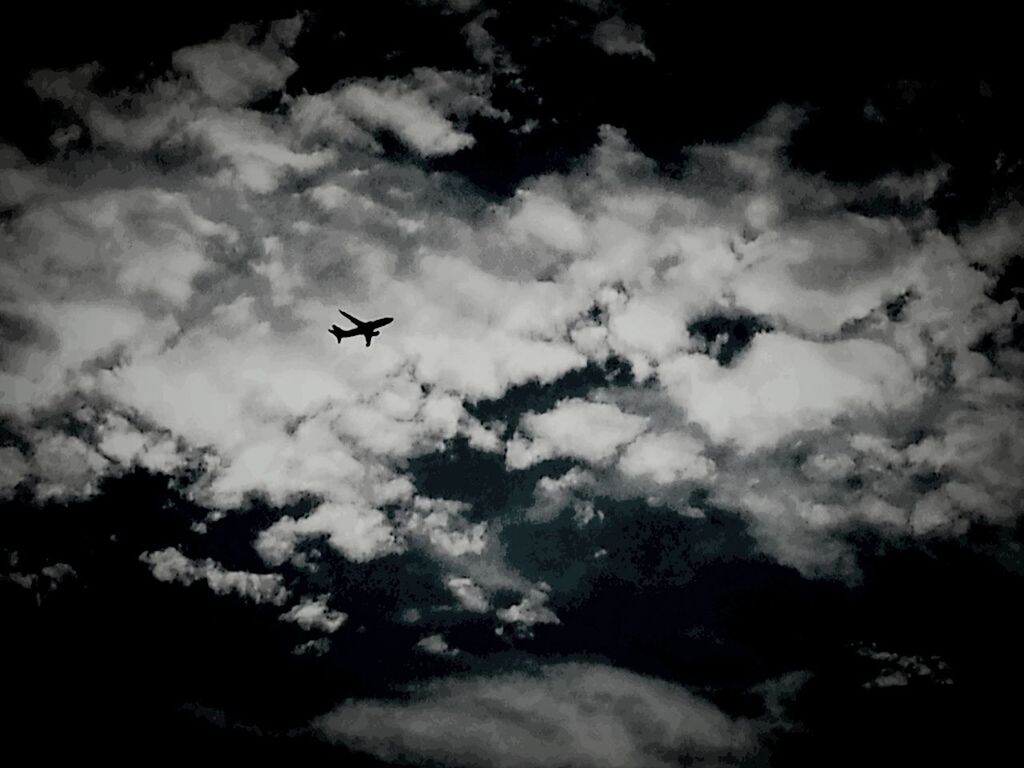 airplane, air vehicle, transportation, flying, sky, mode of transport, cloud - sky, mid-air, cloudy, low angle view, cloud, cloudscape, on the move, travel, nature, journey, weather, public transportation, silhouette, beauty in nature