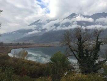 Scenic view of lake and mountains against sky