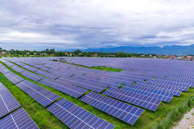 Rows of photovoltaic panels at a solar farm in nepal.