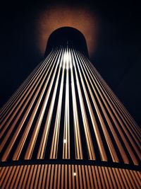 Low angle view of illuminated building against sky at night