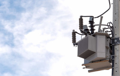 Low angle view of street light against sky