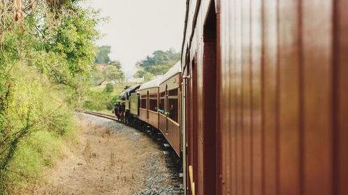 Train on railroad track against sky