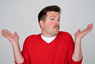 Portrait of young man against white background