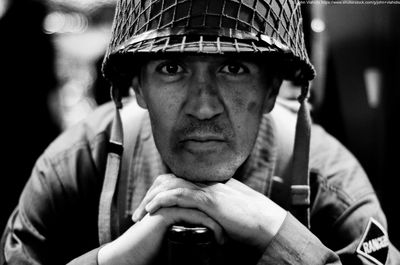 Close-up portrait of soldier wearing helmet
