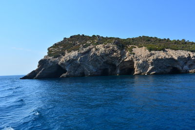 Scenic view of sea against clear blue sky