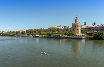 View of the guadalquivir river and the torre del oro, seville, spain