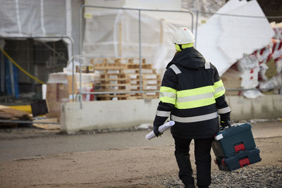 Rear view of engineer at building site