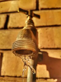 Close-up of faucet against wall