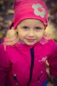 Portrait of cute girl wearing pink hat