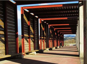 Empty road along built structures