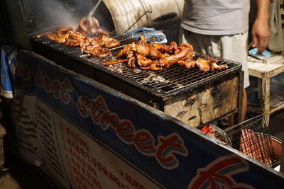 High angle view of meat on barbecue grill