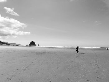Scenic view of beach against sky. haystack rock.