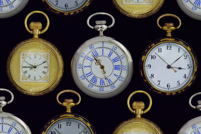 High angle view of pocket watches on table