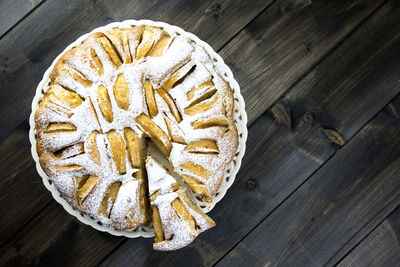 Close-up high angle view of cake on wooden plate