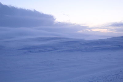 Scenic view of snow covered landscape against sky