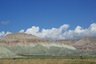 Scenic view of desert against blue sky