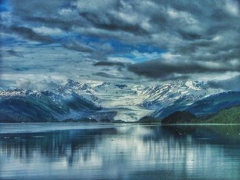 Scenic view of lake against cloudy sky