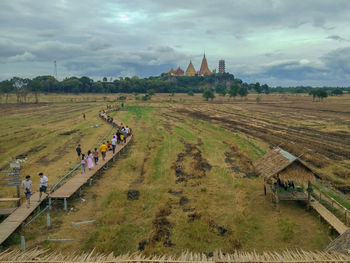 People on field against sky