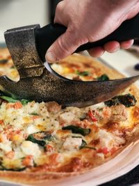 Cropped hand of person preparing food