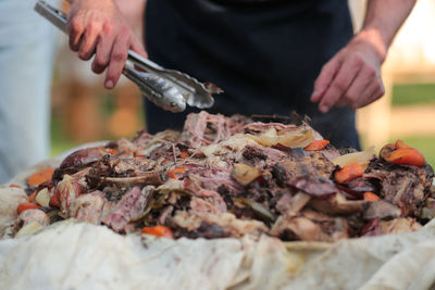 Close-up of man preparing food