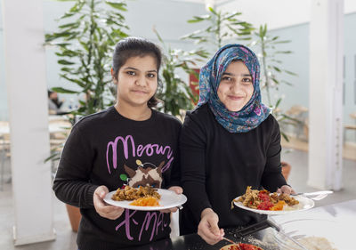 Smiling girls in school canteen