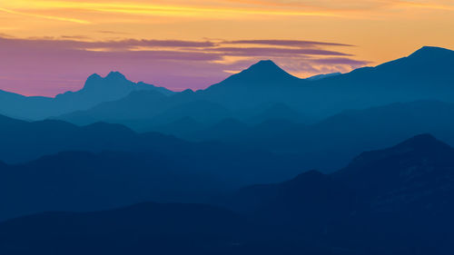 Scenic view of mountains against sky during sunset