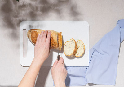 Cropped hand of person holding food