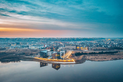 Cityscape against sky during sunset