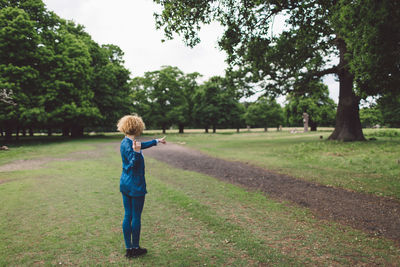 Rear view of woman standing in park