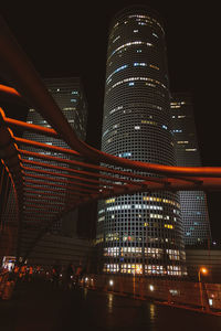 Low angle view of illuminated buildings at night