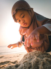 High angle view of young woman holding hands