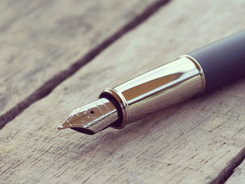 Close-up of pen on table