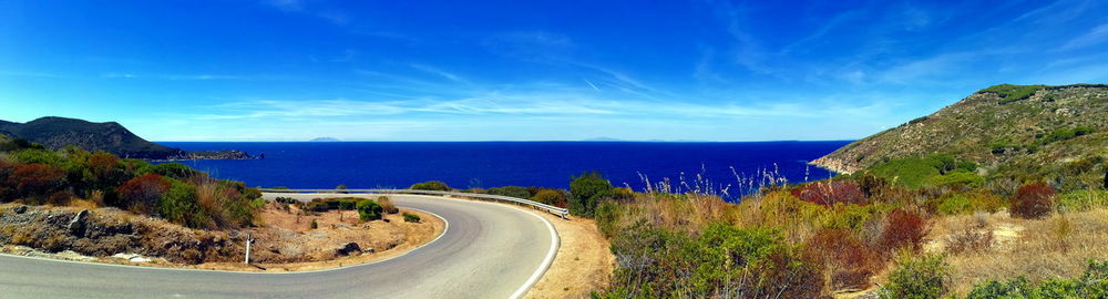 Scenic view of sea against blue sky