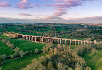 Scenic view of viaduct against sky during sunset