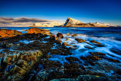 Scenic view of sea against sky at sunset