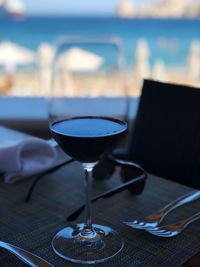 Close-up of red wine in glass on table