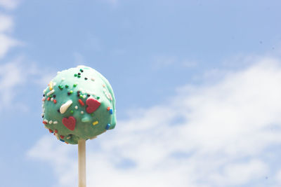 Close-up of lollipop against sky