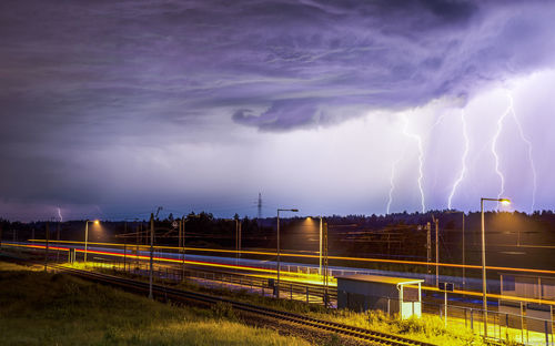 Panoramic shot of light trails against sky