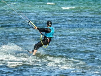 People surfing in sea