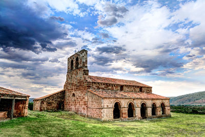 Old building against cloudy sky