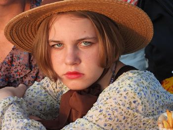 Portrait of young woman wearing hat