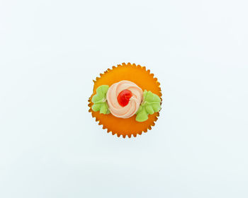 Low angle view of cupcakes against white background