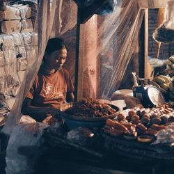Woman working at market stall