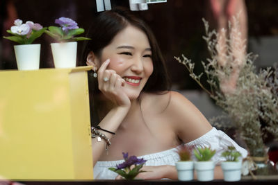 Portrait of smiling young woman outdoors